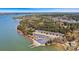 Expansive aerial view showcases a waterfront property with boat ramp, parking, and lush surrounding greenery at 107 Bare Foot Ln, Mooresville, NC 28117