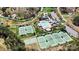 Community pool and tennis courts surrounded by wooded area at 107 Bare Foot Ln, Mooresville, NC 28117