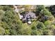 Aerial view of the home, showing its landscaping and wooded surroundings at 107 Bare Foot Ln, Mooresville, NC 28117