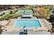 Aerial view of community pool surrounded by lounge chairs and tables at 107 Bare Foot Ln, Mooresville, NC 28117