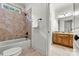 Bathroom with tiled shower, granite vanity and neutral tile flooring at 107 Bare Foot Ln, Mooresville, NC 28117