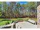 View from deck, overlooking a lawn with mature trees offering privacy at 107 Bare Foot Ln, Mooresville, NC 28117