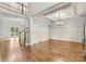 Bright dining room with hardwood floors, wainscoting, and a chandelier at 107 Bare Foot Ln, Mooresville, NC 28117