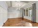 Elegant dining room with hardwood floors, wainscoting, and a chandelier at 107 Bare Foot Ln, Mooresville, NC 28117