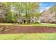 Beautiful two-story brick home with lush lawn and landscaping at 107 Bare Foot Ln, Mooresville, NC 28117
