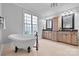 Luxurious main bathroom featuring a soaking tub, double vanities, and a chandelier at 107 Bare Foot Ln, Mooresville, NC 28117