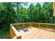 A spacious wooden deck offering panoramic views of the lush, green backyard at 1127 Mckay Rd, Newton, NC 28658