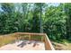 Enjoy the peaceful tranquility of the surrounding forest from the private, newly installed rear deck at 1127 Mckay Rd, Newton, NC 28658
