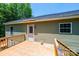 The rear deck provides a serene escape with views of the verdant landscape and offers easy access to the yard at 1127 Mckay Rd, Newton, NC 28658