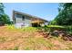 The back exterior view highlights a new wooden deck, ideal for enjoying the serene backyard setting at 1127 Mckay Rd, Newton, NC 28658