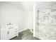 Bathroom featuring a modern vanity and a luxurious walk-in shower with marble-style tile at 1127 Mckay Rd, Newton, NC 28658