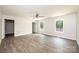 Bright bedroom featuring laminate flooring, a ceiling fan, and natural light from two windows at 1127 Mckay Rd, Newton, NC 28658