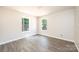 Bright bedroom with two windows and wood-look floors at 1127 Mckay Rd, Newton, NC 28658