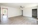 Bedroom featuring wood laminate flooring, a ceiling fan, and ample natural light at 1127 Mckay Rd, Newton, NC 28658