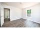 Bright bedroom with a window and wood-look flooring at 1127 Mckay Rd, Newton, NC 28658