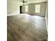 Spacious bedroom featuring hardwood floors, natural light from the window and ceiling fan at 1127 Mckay Rd, Newton, NC 28658
