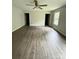 Spacious bedroom with wood flooring, neutral walls, ceiling fan and natural light from the windows at 1127 Mckay Rd, Newton, NC 28658