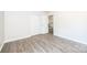 Bright bedroom with closet and wood-look flooring at 1127 Mckay Rd, Newton, NC 28658