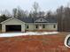 Charming one-story home with an attached two car garage, set on a spacious lot with a new front porch at 1127 Mckay Rd, Newton, NC 28658