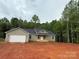 New construction featuring an attached two-car garage and front porch at 1127 Mckay Rd, Newton, NC 28658