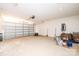 View of the spacious garage with a roll-up door and ample space for storage and hobbies at 1127 Mckay Rd, Newton, NC 28658
