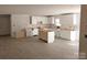 Bright kitchen with new white cabinets and modern flooring. The open layout will be great for entertaining at 1127 Mckay Rd, Newton, NC 28658