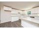 Modern kitchen featuring white cabinets, granite countertops, and stainless steel sink at 1127 Mckay Rd, Newton, NC 28658