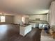 Bright, modern kitchen with white cabinets, granite counters, island and hardwood floors at 1127 Mckay Rd, Newton, NC 28658