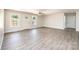 Bright living room features wood-look flooring, neutral paint, and a ceiling fan at 1127 Mckay Rd, Newton, NC 28658