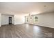 Large living room with wood-look floors, neutral walls, and ample natural light at 1127 Mckay Rd, Newton, NC 28658