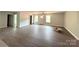 Open-concept living area with wood floors and ample natural light at 1127 Mckay Rd, Newton, NC 28658