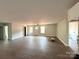 Bright living room with hardwood floors, modern fan, and natural light from windows at 1127 Mckay Rd, Newton, NC 28658