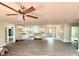 Spacious open-concept living area with modern ceiling fan, hardwood floors, and natural light at 1127 Mckay Rd, Newton, NC 28658
