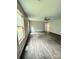 Open living room features wood floors, neutral walls, bright windows and ceiling fan at 1127 Mckay Rd, Newton, NC 28658