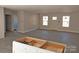 Spacious living area featuring hardwood floors, light-filled windows, and neutral paint, offering a bright and modern aesthetic at 1127 Mckay Rd, Newton, NC 28658