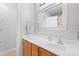 Neutral bathroom with wood vanity, ample counter space, and a large framed mirror at 11507 Rabbit Ridge Rd, Charlotte, NC 28270