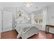 Bright bedroom with a white canopy bed, vaulted ceiling and large window with natural light at 11507 Rabbit Ridge Rd, Charlotte, NC 28270