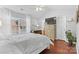 Comfortable bedroom featuring a dresser with TV, a window with natural light, and a plant at 11507 Rabbit Ridge Rd, Charlotte, NC 28270