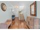 Inviting foyer with hardwood floors, staircase, stylish furniture, and ample natural light at 11507 Rabbit Ridge Rd, Charlotte, NC 28270