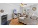 Cozy living room with hardwood floors, fireplace, stylish furnishings, and ample natural light at 11507 Rabbit Ridge Rd, Charlotte, NC 28270