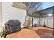 Charming patio area with pergola, brick pavers, privacy fence, and space for grilling at 11507 Rabbit Ridge Rd, Charlotte, NC 28270