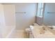Bright bathroom featuring a toilet, tub, sink, and window at 11630 Retriever Way, Charlotte, NC 28269