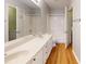 Bathroom with double sinks, tub and shower combination, toilet and wood floors at 11630 Retriever Way, Charlotte, NC 28269