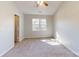 Sunlit bedroom featuring neutral carpet, ample natural light, and a ceiling fan at 11630 Retriever Way, Charlotte, NC 28269