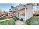 Attractive townhome showing landscaping, siding, and brick facade at 11630 Retriever Way, Charlotte, NC 28269