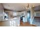 Updated kitchen with stainless steel appliances, white cabinets, and a modern lighting fixture at 11630 Retriever Way, Charlotte, NC 28269