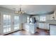 Bright open kitchen layout with stainless steel appliances and access to an outdoor patio at 11630 Retriever Way, Charlotte, NC 28269