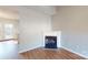 Cozy living room featuring a fireplace, wood-look floors, and ample natural light at 11630 Retriever Way, Charlotte, NC 28269
