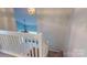 View from the top of a carpeted staircase with white railing overlooking the main floor at 11630 Retriever Way, Charlotte, NC 28269