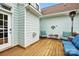 Cozy back deck with outdoor seating, a heater, and decorative elements, perfect for relaxation and entertaining at 1214 Foxfield Rd, Waxhaw, NC 28173